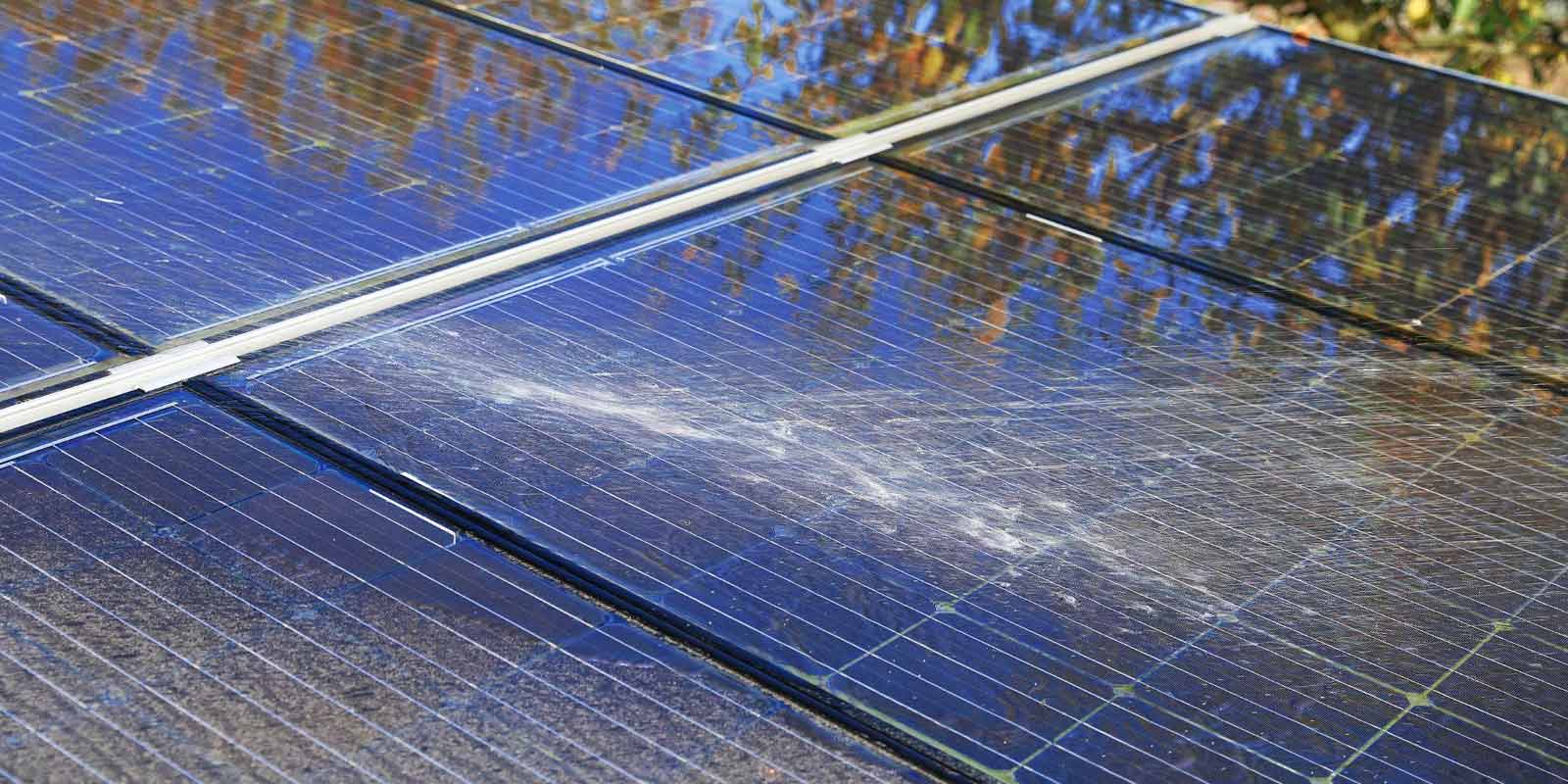 Water Being Sprayed on Dirty Solar Panels